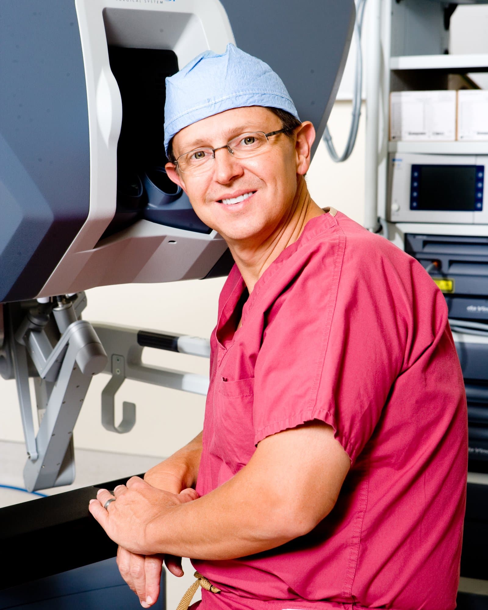 Dr. Asbery with robotic surgery system